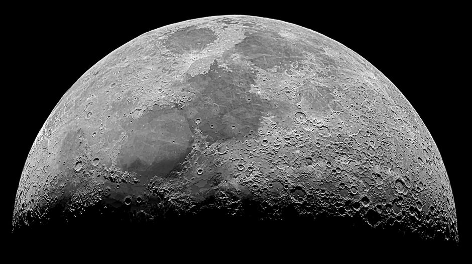 High-resolution monochrome image of the moon's surface showcasing craters and details.